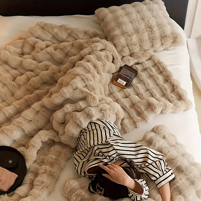 Indulge in this ultra soft faux fur throw blanket, a plush and cozy addition to your home comfort essentials.
