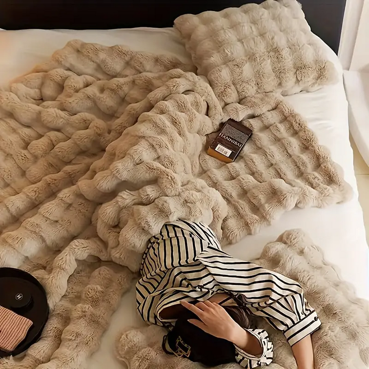 Indulge in this ultra soft faux fur throw blanket, a plush and cozy addition to your home comfort essentials.