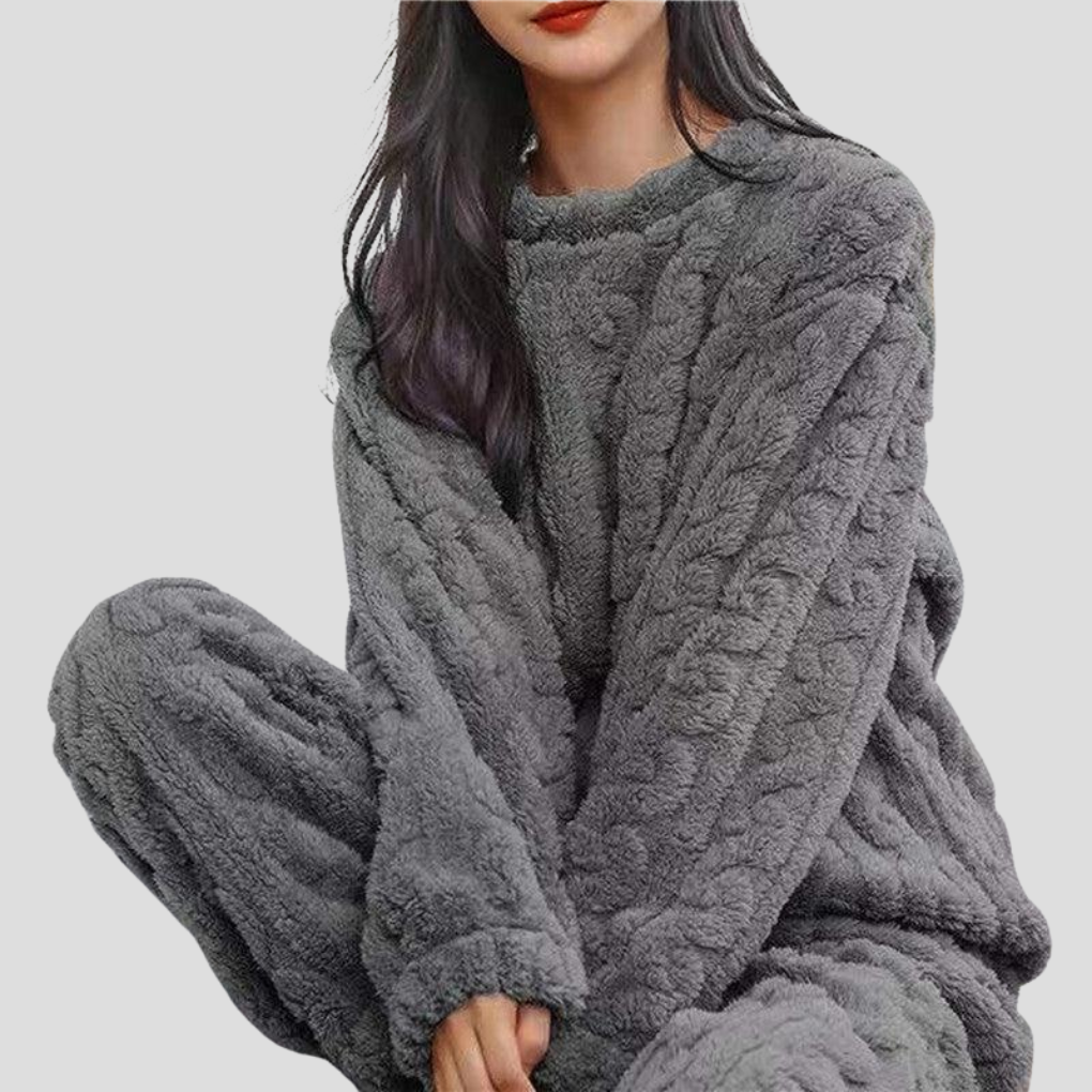 Warm women's fleece pajama set for cozy winter nights. Relax in this soft, comfortable one-size sleepwear.