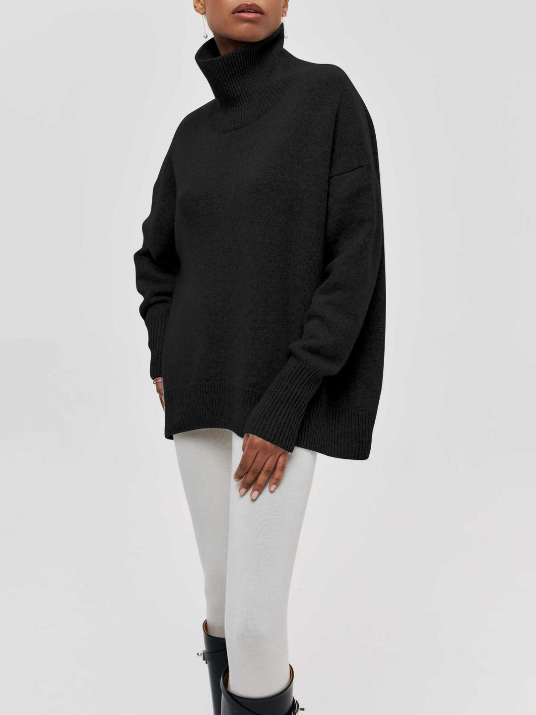 Model showcasing a fashionable women's oversized turtleneck knitwear for winter.