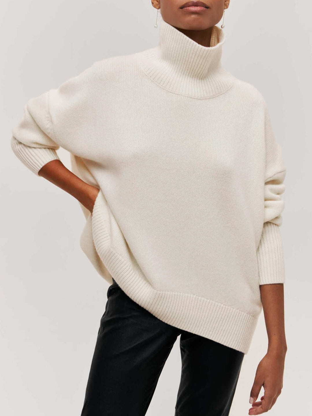 Casual yet chic oversized turtleneck sweater, a must-have women's winter clothing item.