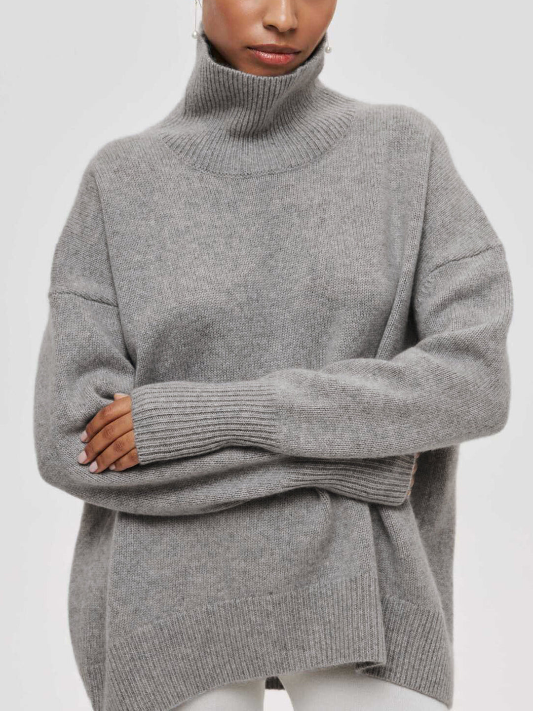 Versatile women's oversized turtleneck sweater, perfect for layering in cold weather.