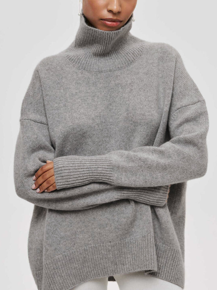 Versatile women's oversized turtleneck sweater, perfect for layering in cold weather.