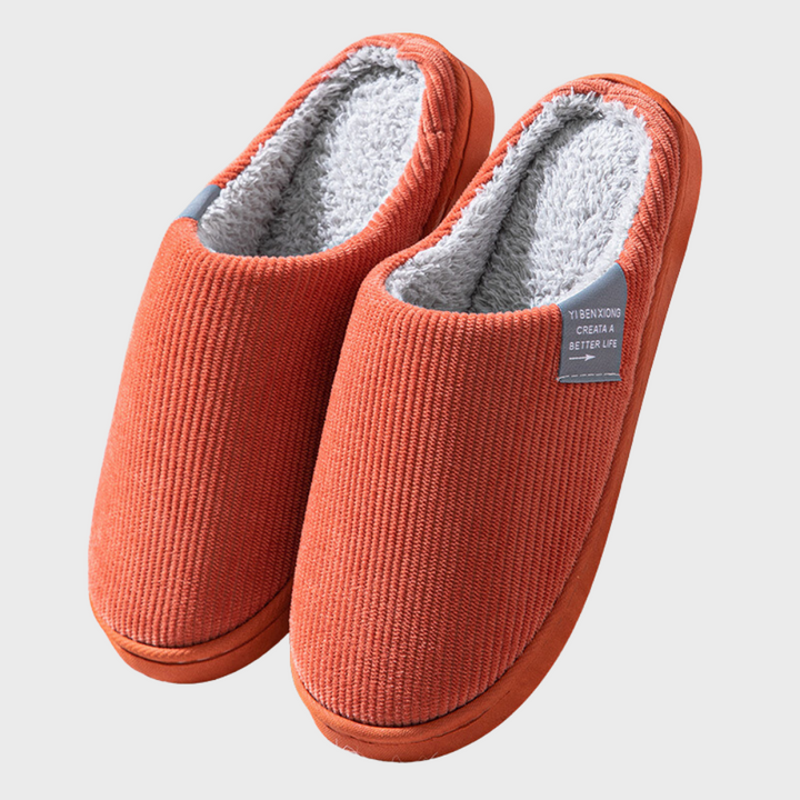 Soft women's warm indoor slippers, perfect for cozy winter lounging. Comfortable slip-on house footwear.