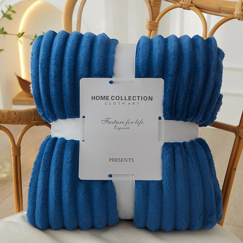 CozyStripe striped blanket, the ideal warm and soft throw for any sofa.