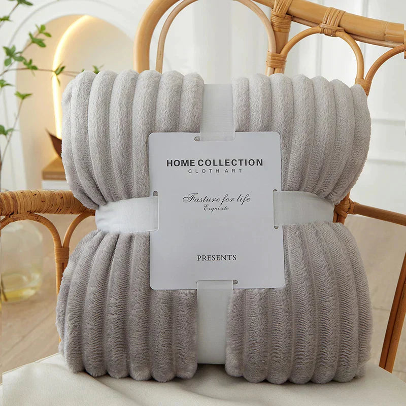 Elegant wide stripes adorn the CozyStripe flannel fleece blanket.