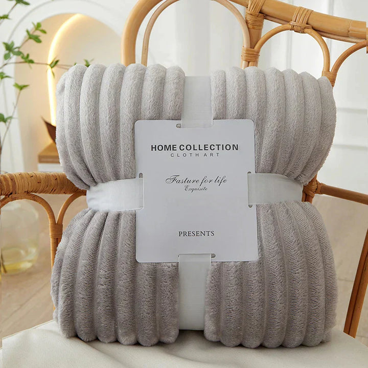 Elegant wide stripes adorn the CozyStripe flannel fleece blanket.