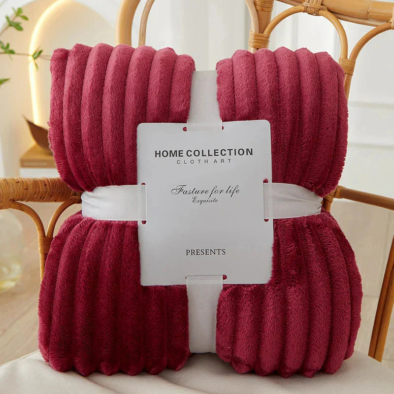 Snuggle up in the CozyStripe warm fleece blanket, designed for comfort.