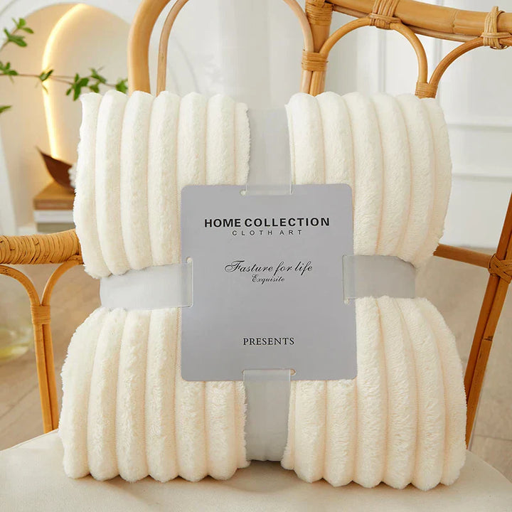 This CozyStripe blanket offers a cozy feel with its flannel fleece and stripe design.
