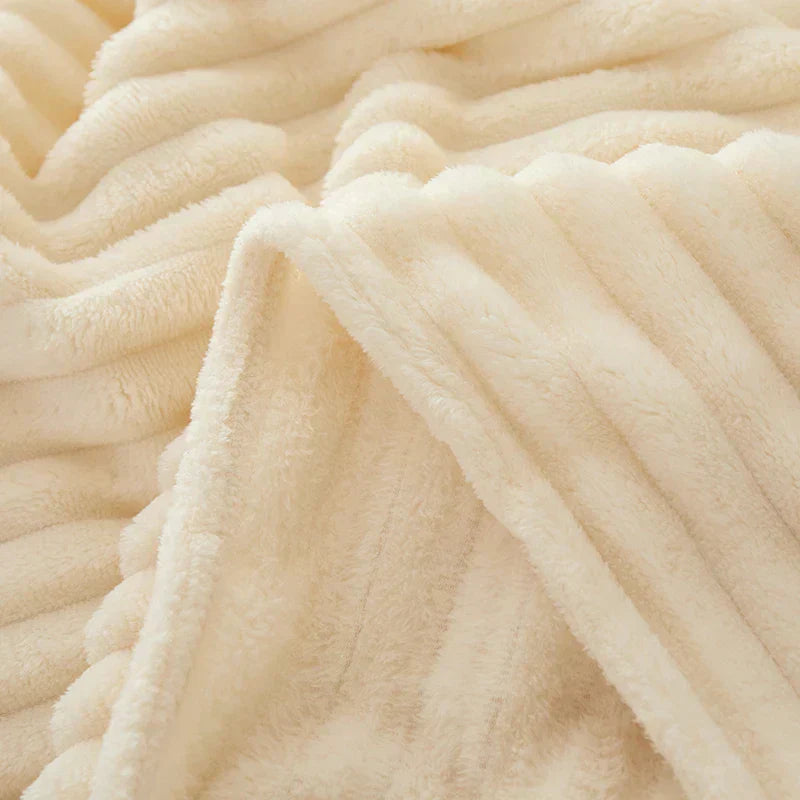 Indulge in the softness of the CozyStripe flannel fleece blanket.