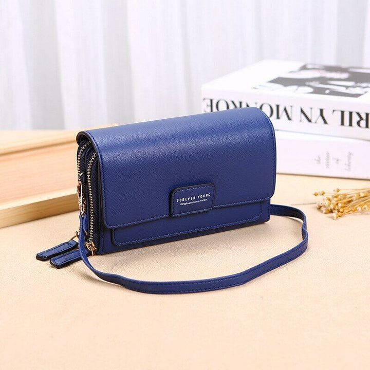Women's travel crossbody bag, multi-pocket design in sleek PU leather.