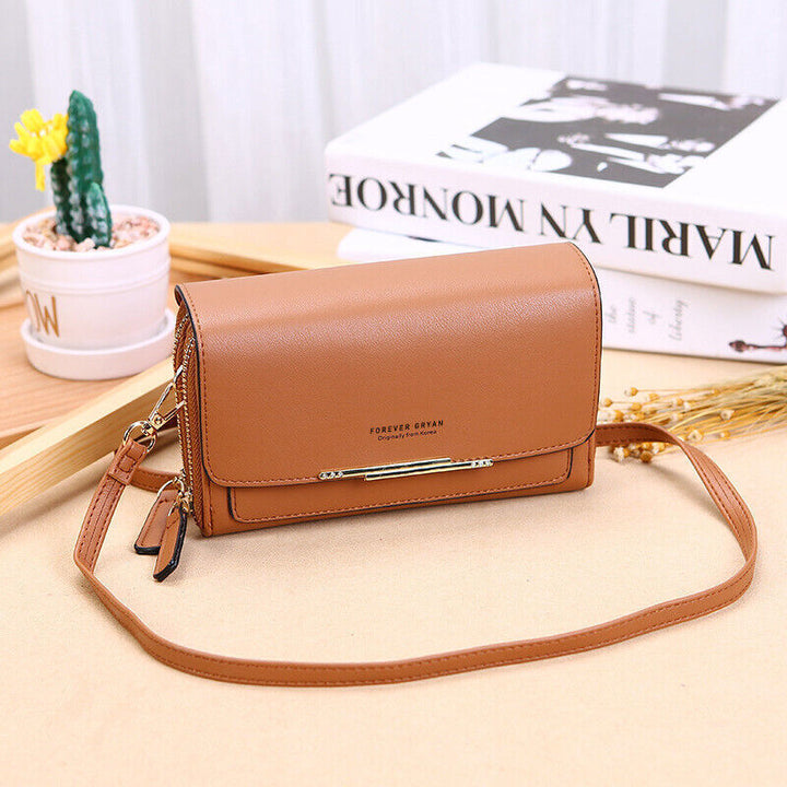Chic PU leather women's shoulder bag with multiple compartments for organization.