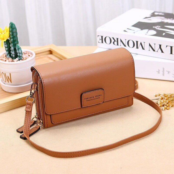 Women's PU leather crossbody bag, featuring multiple pockets for optimal organization.