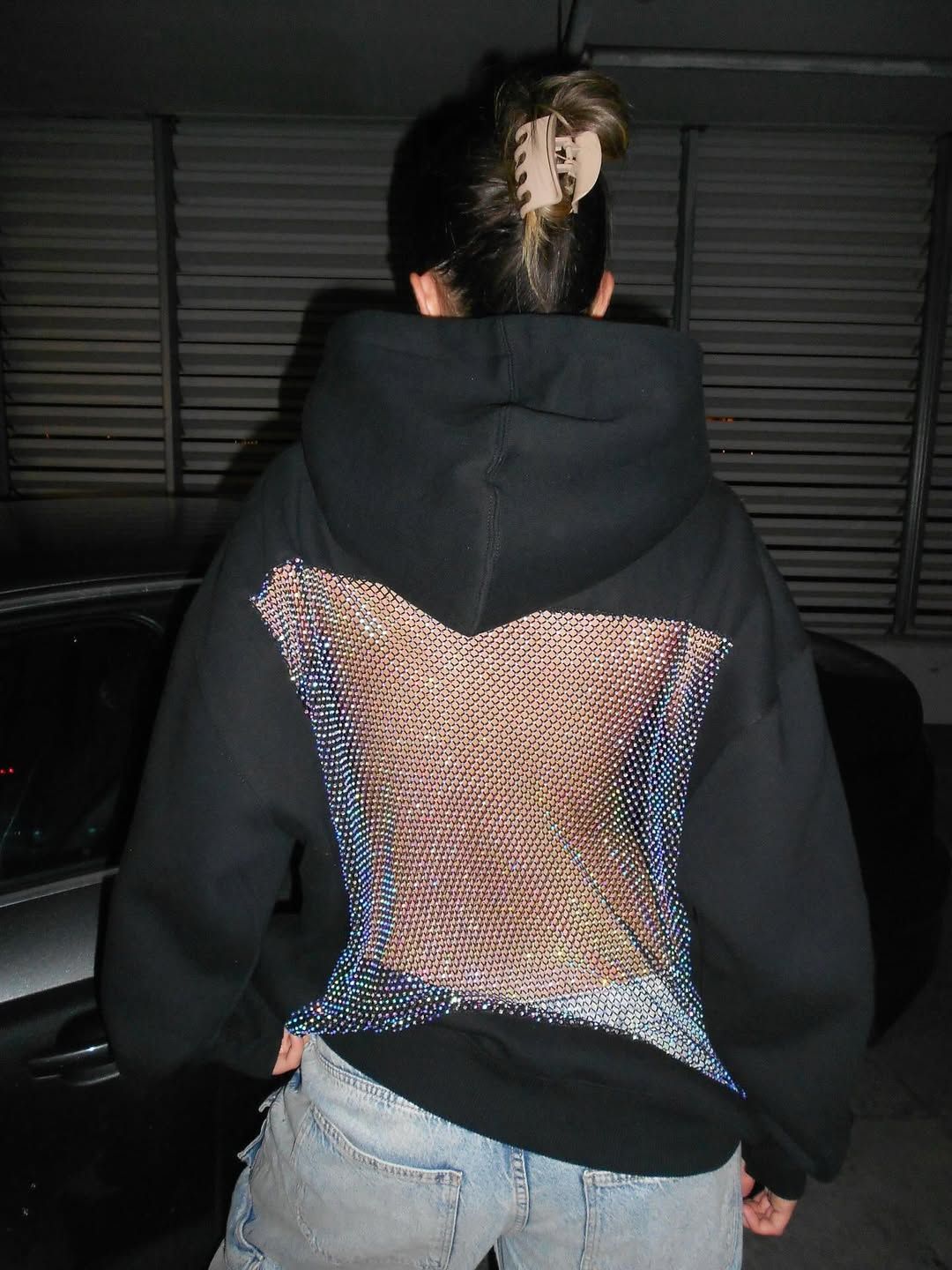 Chic women's dazzling crystal mesh open back hoodie, perfect for a night out.