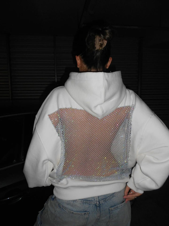 Statement crystal mesh hoodie for women, with a chic open back. Ideal for parties.