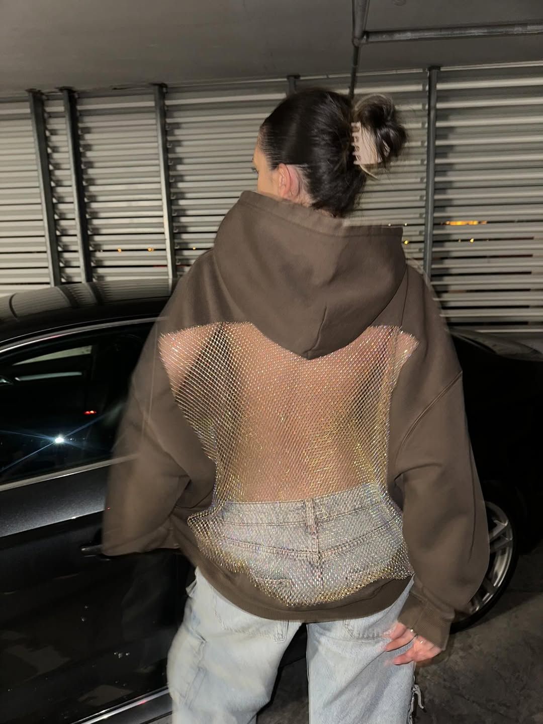 Sparkling crystal mesh women's hoodie with a daring open back design.