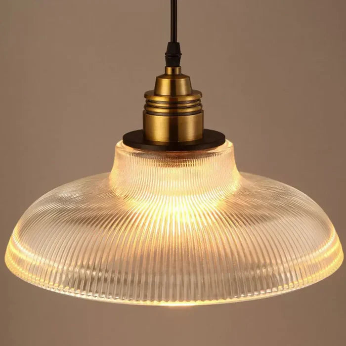Close-up of CrystalLoom amber glass pendant light, showing intricate details.