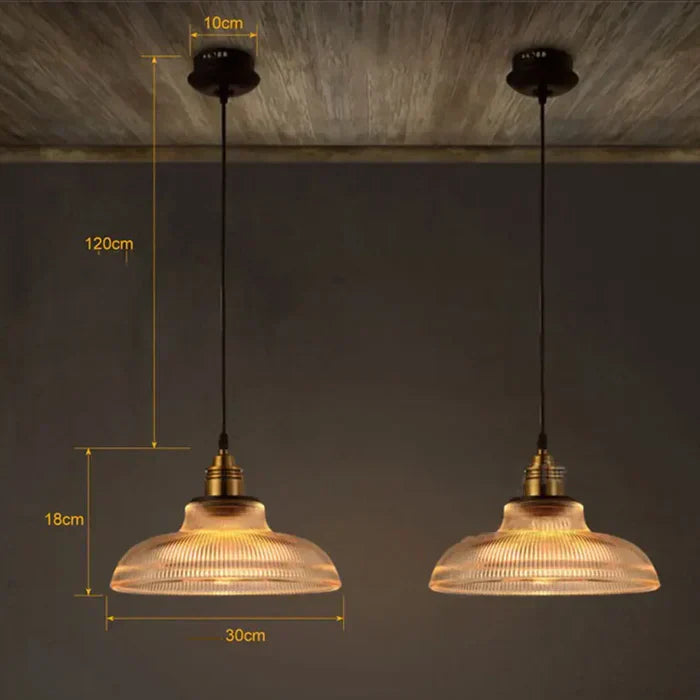 Stylish CrystalLoom glass pendant light in amber, perfect for warm lighting.