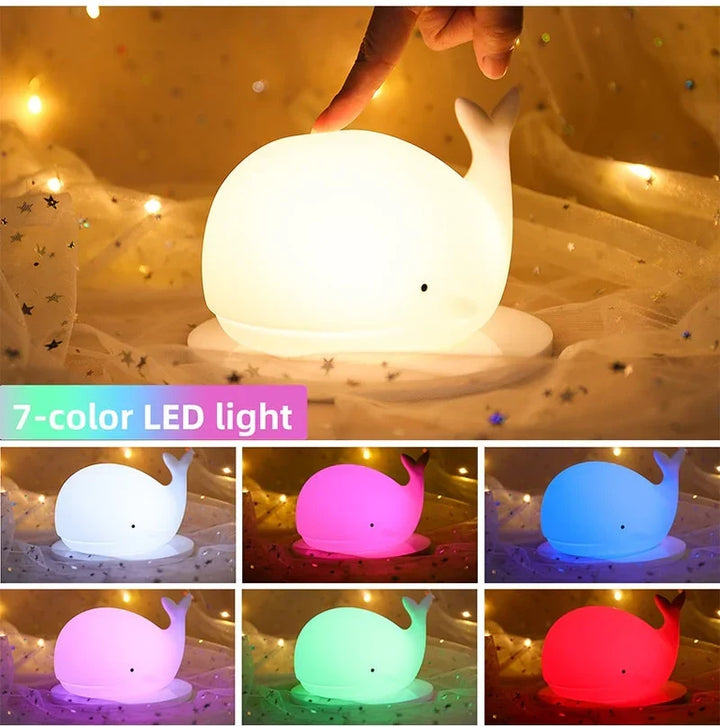 Soft silicone whale LED night light for nursery. Gentle color-changing sleep aid for children's room & bedside.