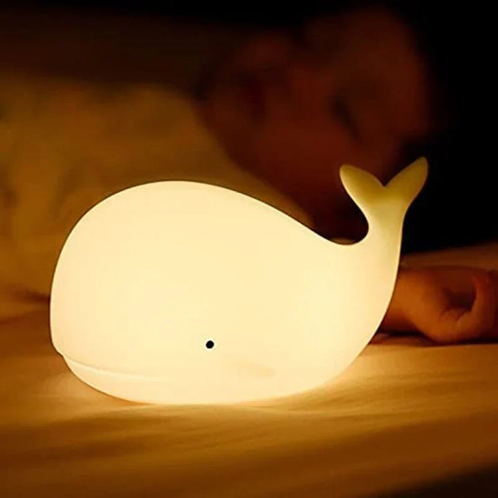 Interactive color-changing whale lamp. A cute LED night light & gentle sleep aid for any child's room.