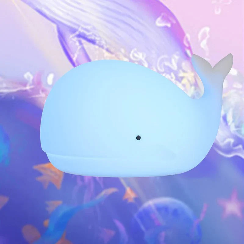 Gentle silicone whale nursery night light, featuring multiple LED colors to comfort toddlers & enhance decor.