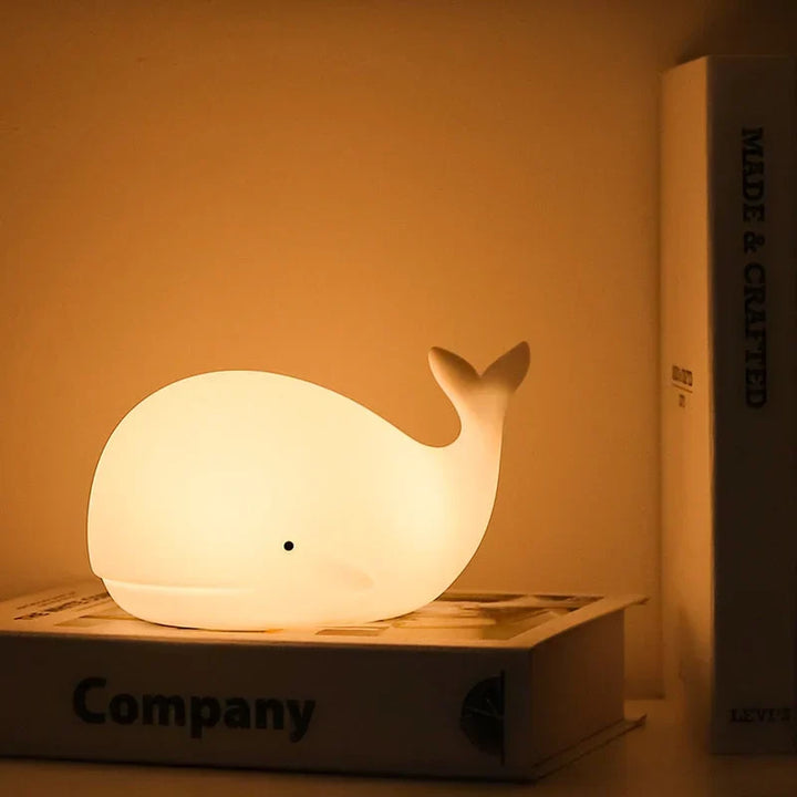 Cute whale night light with color changing LED, perfect for kids' rooms and nursery decor.