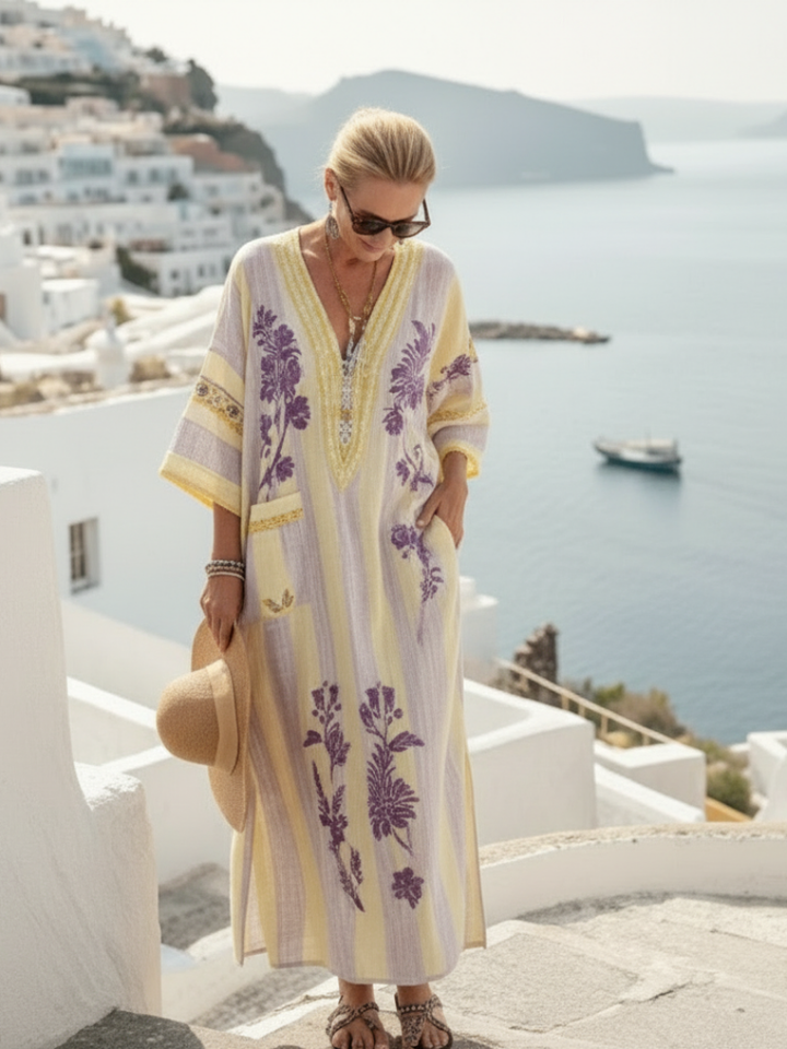 Chic women's V-neck floral & striped half-sleeve maxi dress, ideal for relaxed summer days or resort vacations.
