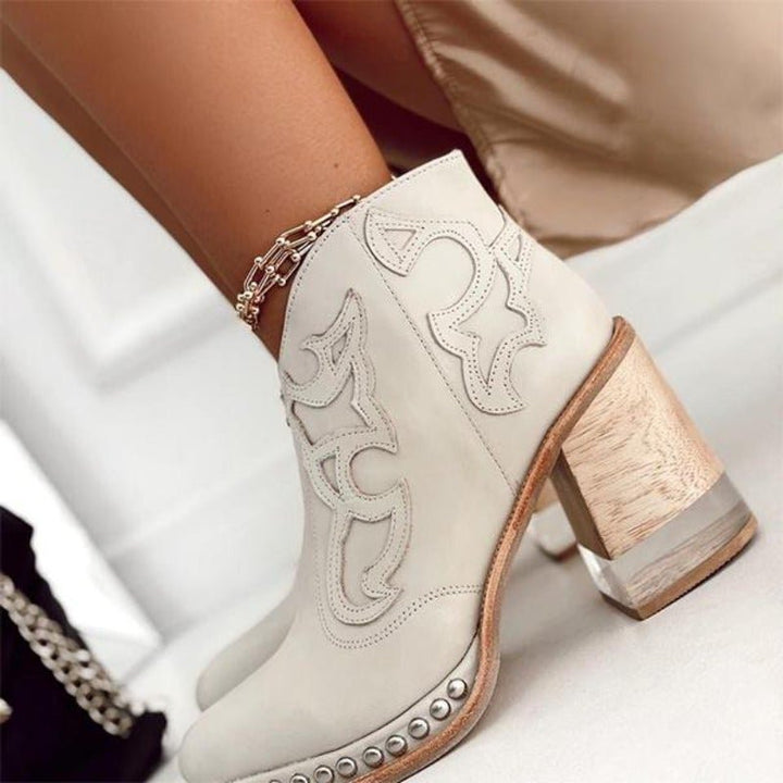 Women's chic cut-out cowboy ankle boots with a stylish block heel. Perfect for western fashion.