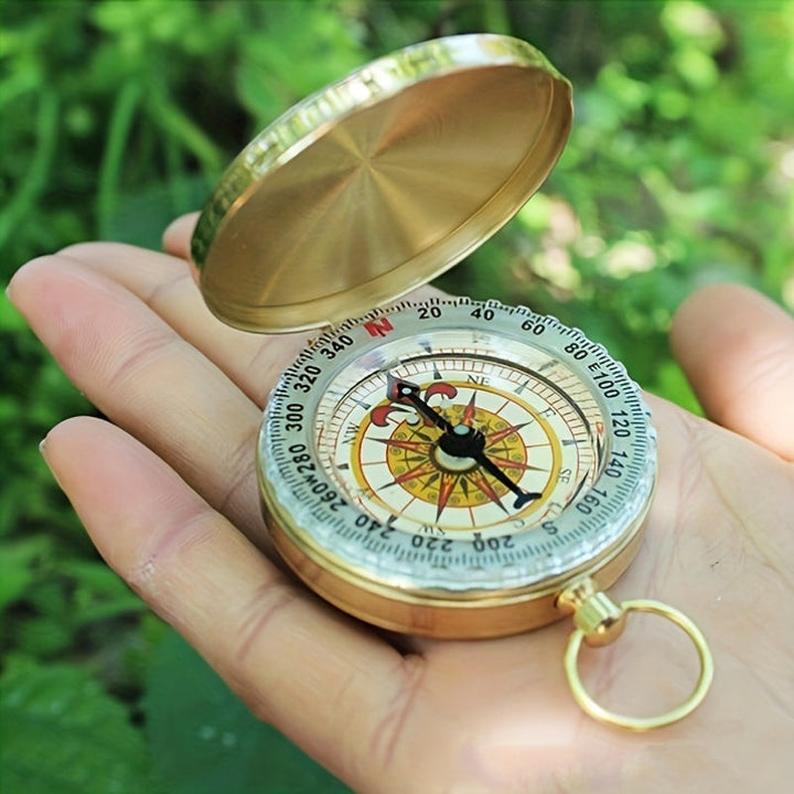 Elegant copper survival compass with a classic design. Durable, waterproof outdoor gear for reliable navigation.