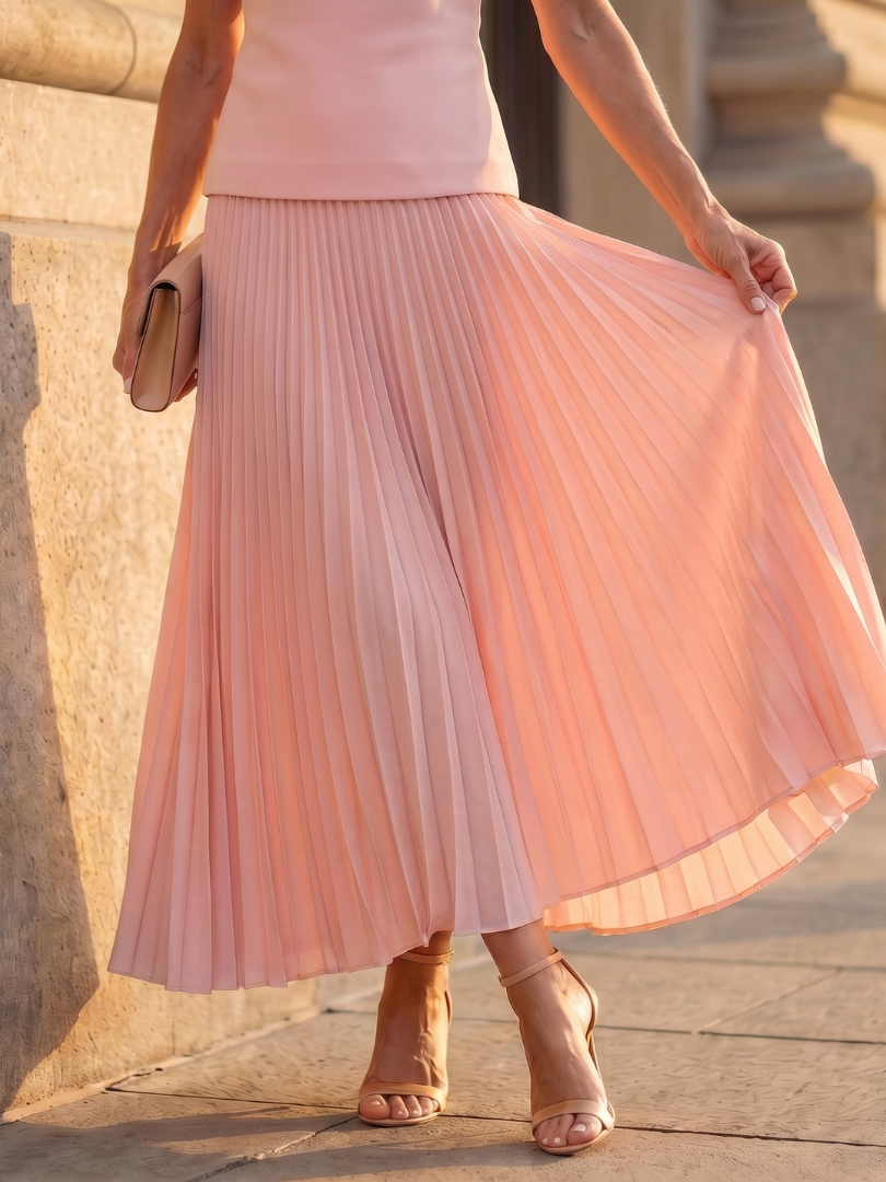 Women's formal two-piece set featuring an elegant structured bodice top and a long pleated maxi skirt.