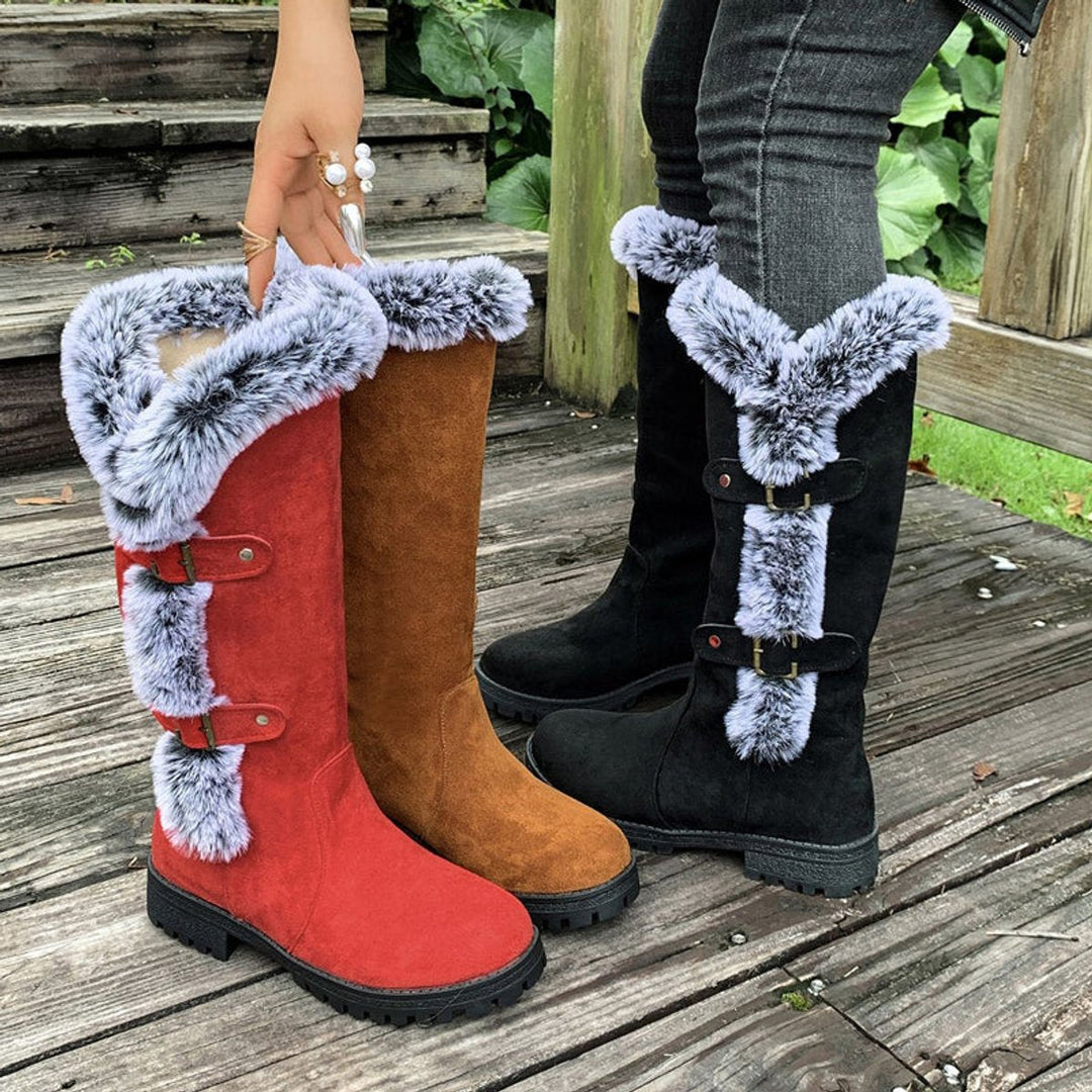 Stylish women's knee-high buckle boots with warm fur trim, great for winter fashion & comfort.