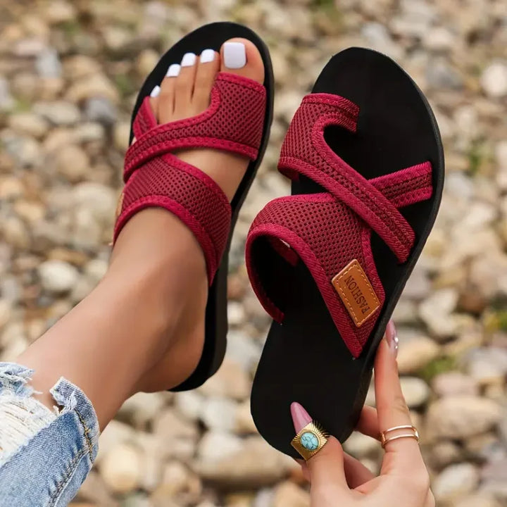 Comfortable women's travel sandals with arch support, lightweight design for all-day wear.