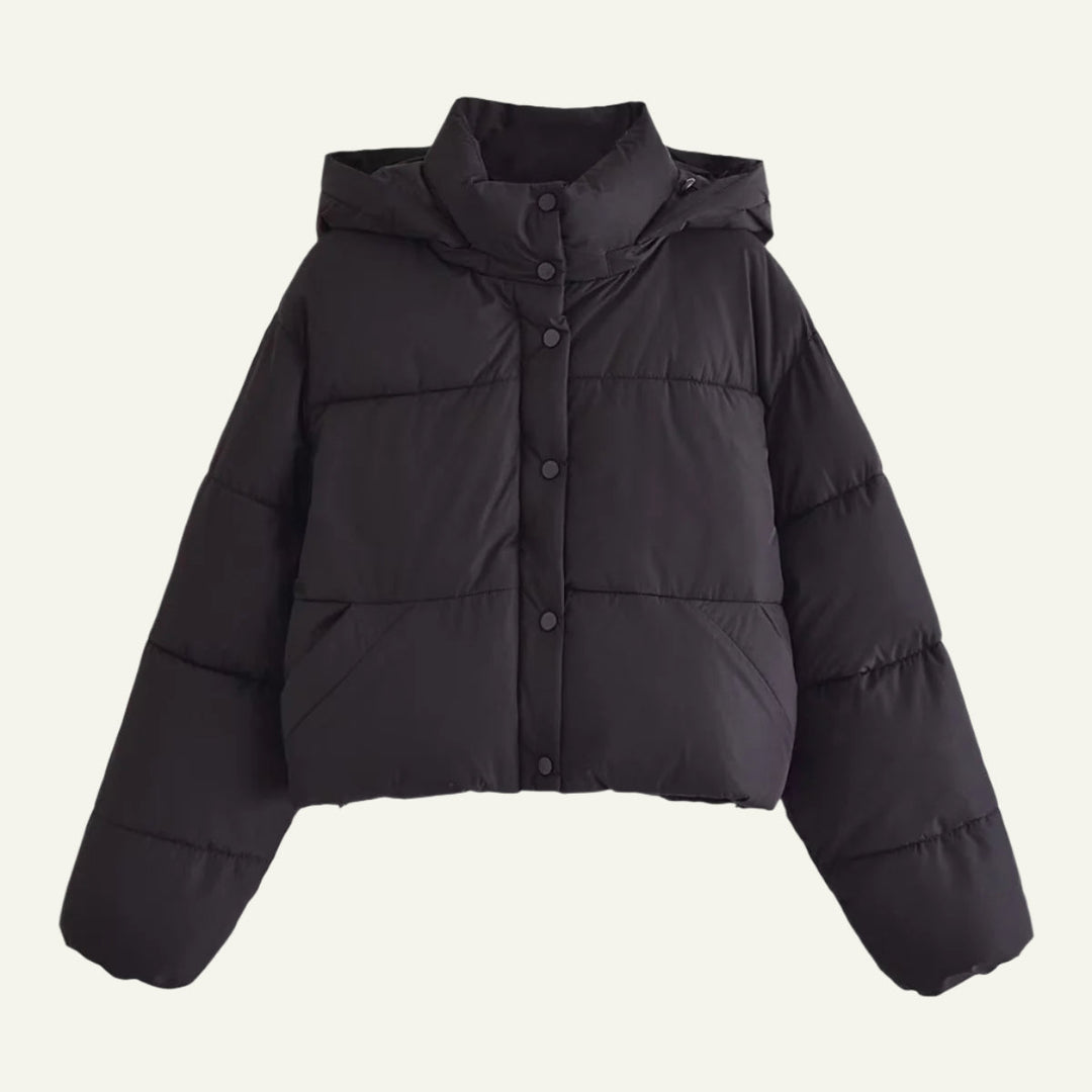 Sleek black puffer jacket for women. A lightweight, warm winter coat designed for ultimate cold weather protection.