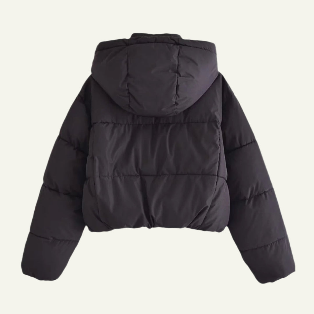High-quality women's black puffer jacket. Comfortable, lightweight & warm winter outerwear for all occasions.
