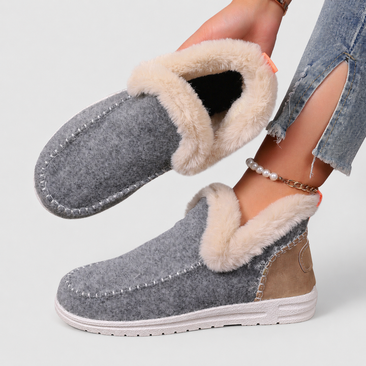 Close-up of women's orthopedic house slippers, showcasing supportive arch & cozy interior.