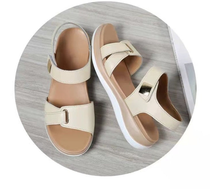 Stylish women's wide-toe sandals in white, featuring adjustable straps for comfortable all-day casual summer wear.