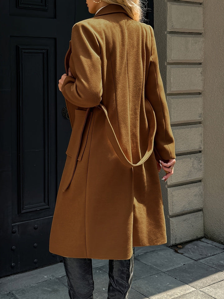 Navy women's classic trench coat with belt. Tailored outerwear for elegant spring and fall fashion.