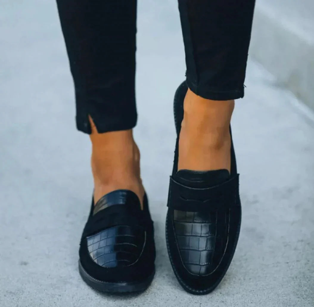 Classic women's textured loafers, offering elegant comfort and versatile everyday style for any casual outfit.