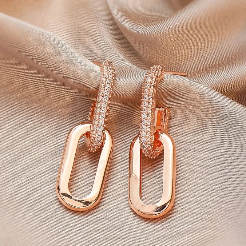 Elegant slim loop earrings with cubic zirconia, deluxe silver stainless steel women's jewelry.