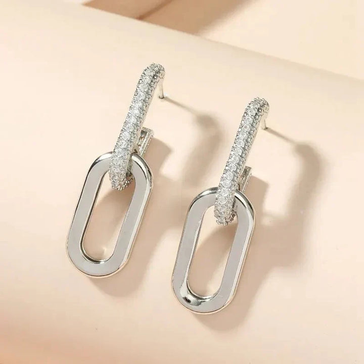 Stainless steel slim deluxe hoop earrings for women, classic gold tone jewelry.