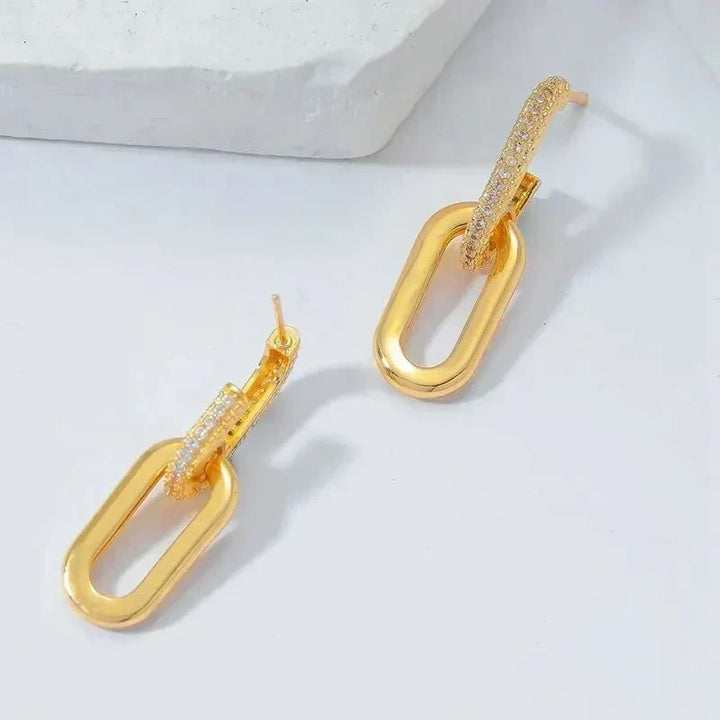 Rose gold slim deluxe hoop earrings, elegant women's fashion accessory in stainless steel.