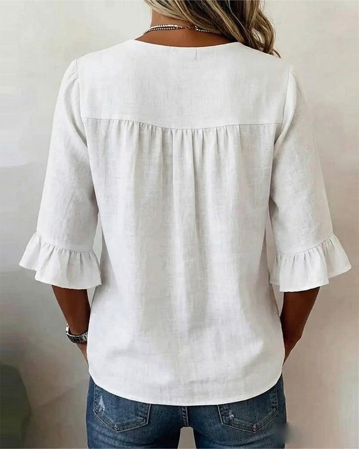 Modern ladies summer top, sophisticated style, with button front & lovely ruffle sleeves.