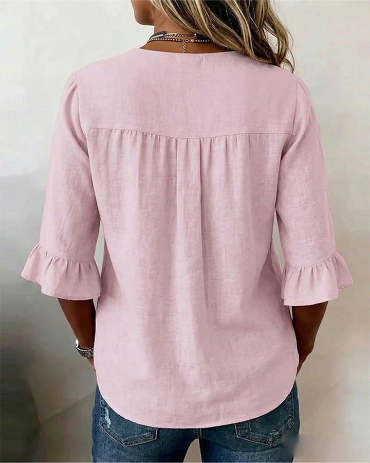 V-neck summer blouse for women, elegant ruffle sleeves, and a classic button-front.