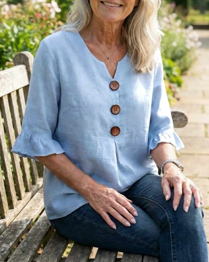 Casual sophisticated women's top, button-front, with graceful ruffle sleeves for warm days.