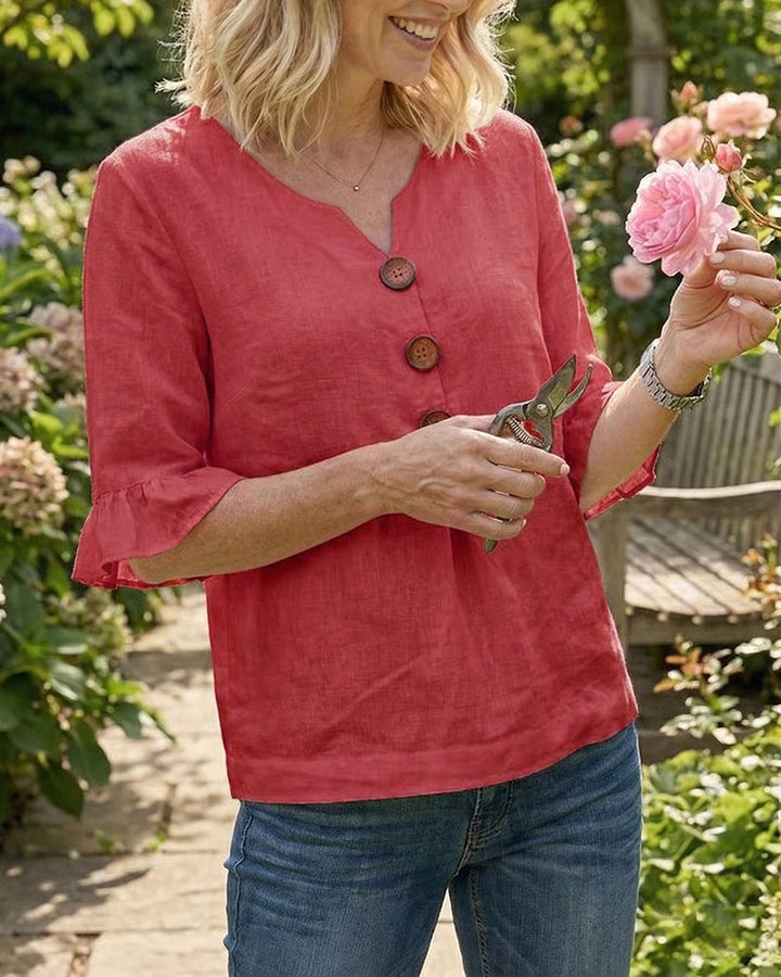 Chic v-neck women's top, summer ready, with fashionable ruffle sleeves & button detailing.