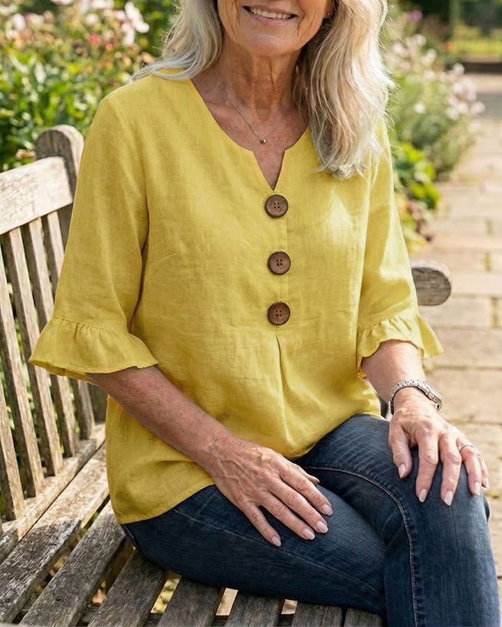Elegant ladies casual blouse, buttoned, with delicate ruffle sleeves, ideal for summer.