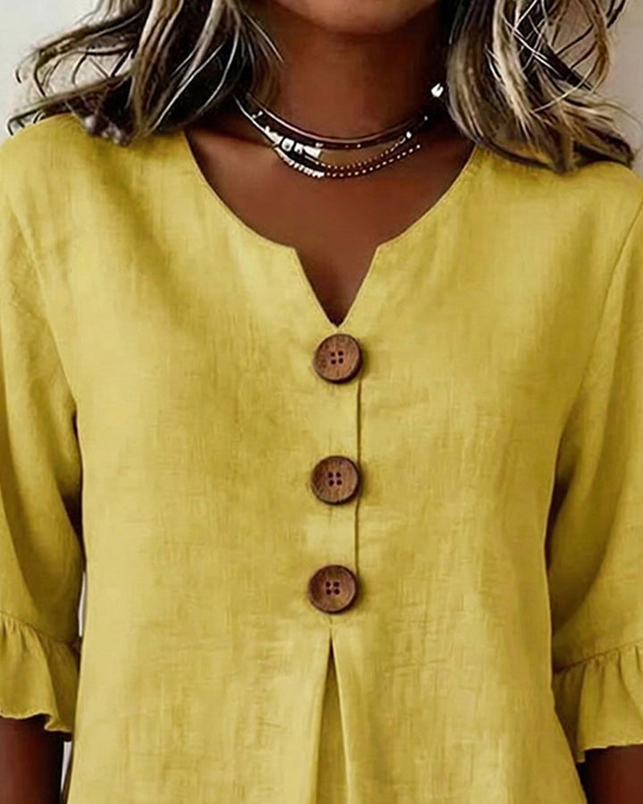 Button-front women's top, sophisticated, with stylish ruffle sleeves, perfect for summer.