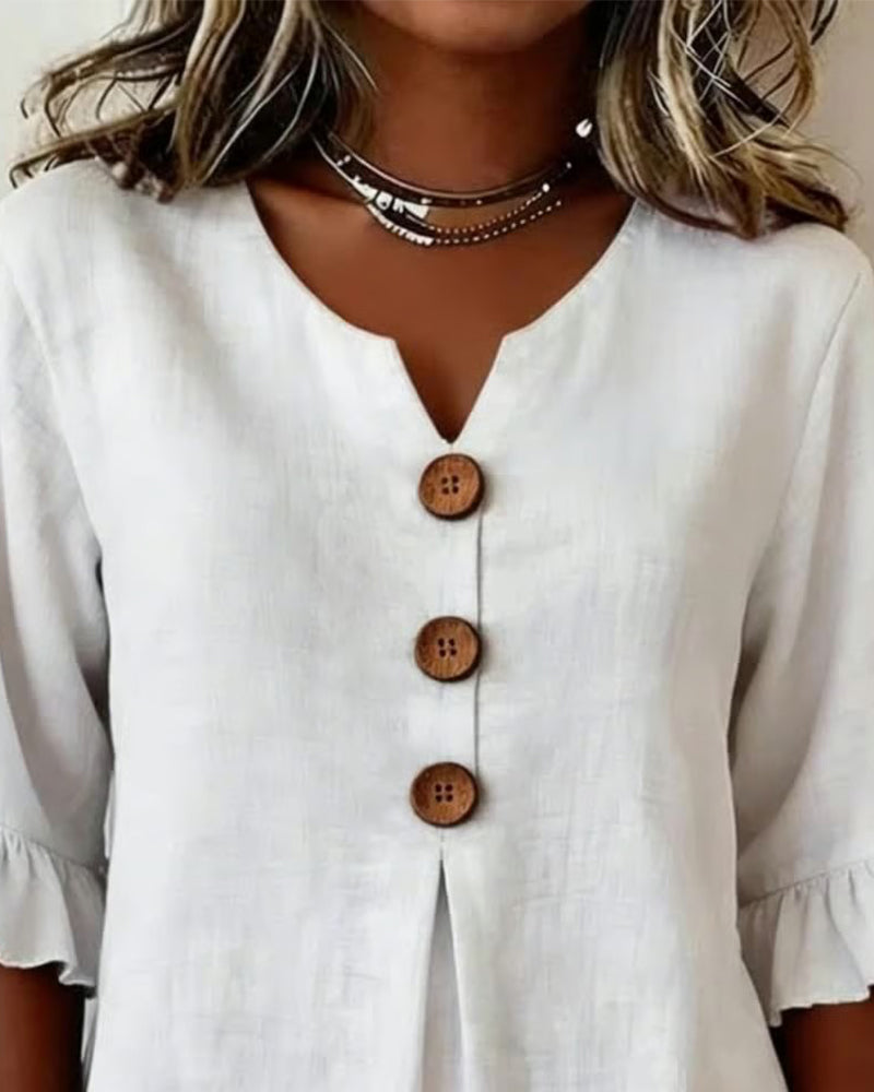 Warm weather ladies top, relaxed fit, with delicate ruffle sleeves & a button front.