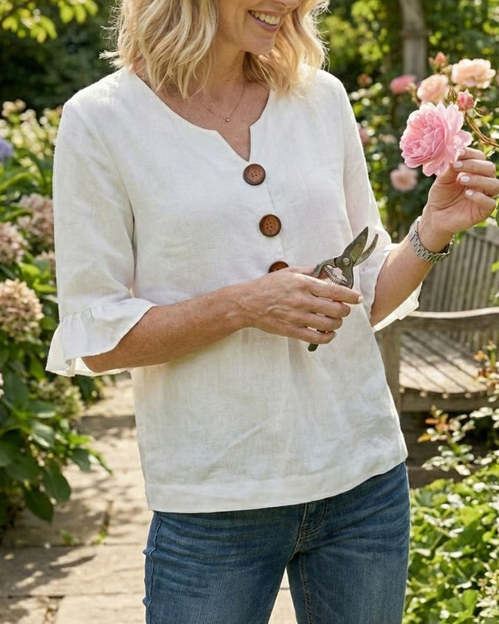 Everyday women's summer shirt, button-front, v-neck, & charming ruffle sleeve detail.