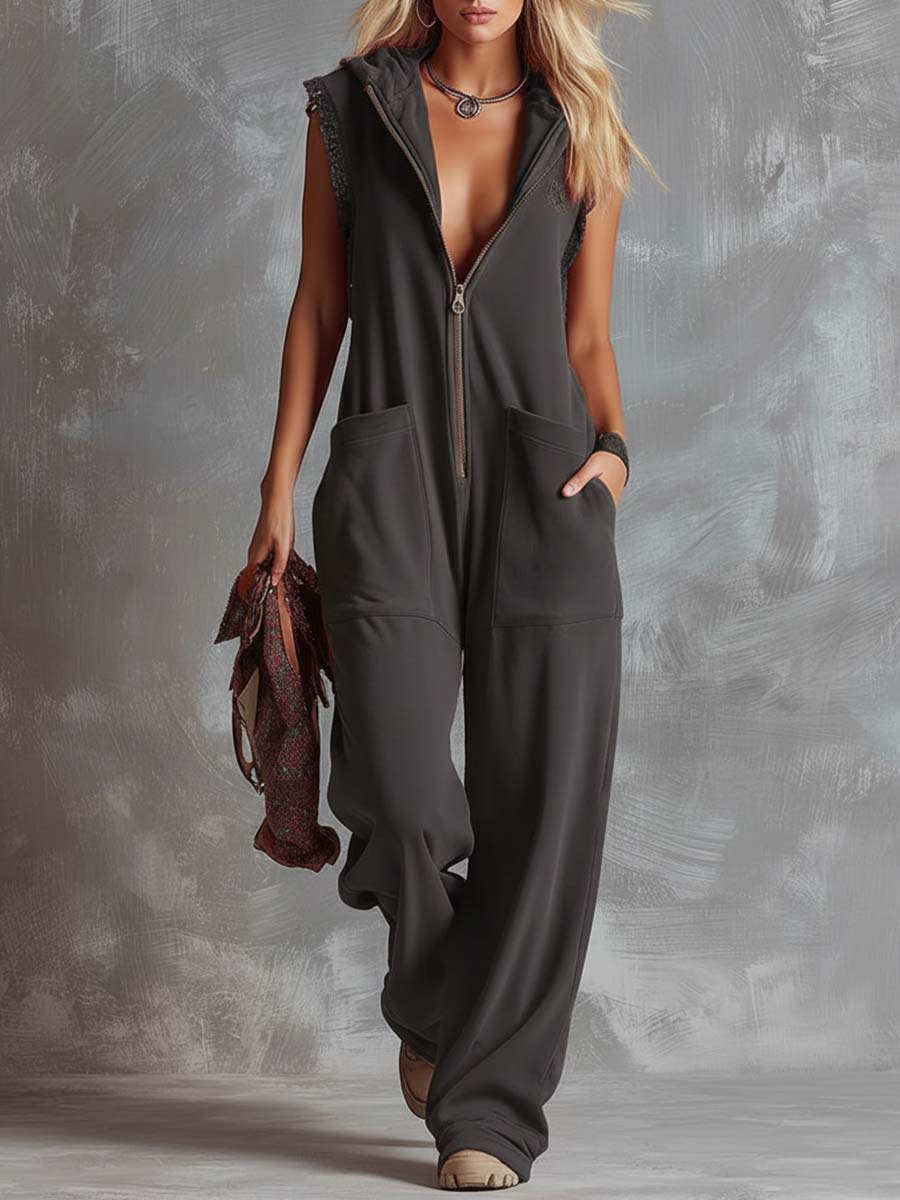Woman wearing a comfortable hooded sleeveless wide-leg jumpsuit. Ideal for relaxed summer days & casual events.